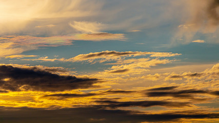 Clouds and sky in the rays of a red sunset