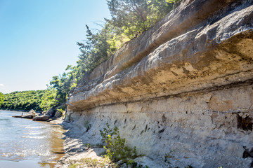 limestone wall beside a river