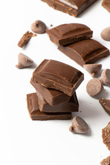 chocolate pieces on white background