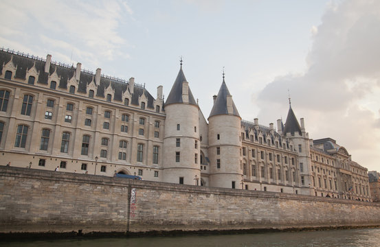 Palais de Justice standing on the banks of river Seine on the Ile de la Cite, Paris - France.