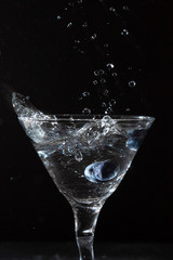 martini glass with blueberry splash