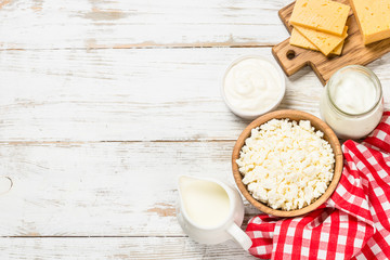 Dairy product at white wooden table.