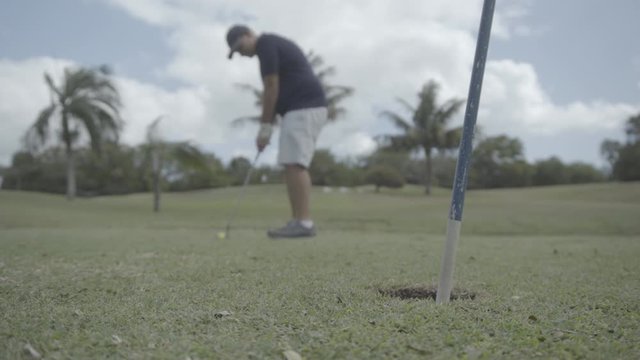 main train to play golf and miss the hole