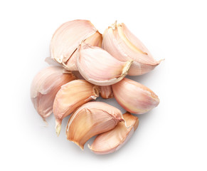 Pile of garlic cloves isolated on white background. Top view.
