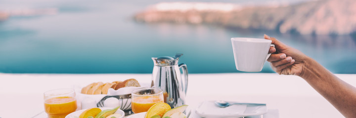 Breakfast coffee cup cruise vacation woman drinking at outside restaurant balcony ship deck. Banner panorama of person eating holding mug at luxury cafe hotel. Brunch lifestyle panoramic banner.