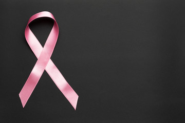 Pink ribbon on a black background.Breast cancer.