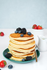 stack of pancakes with berries