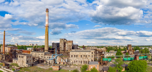 Aerial drone shot of old coke coal industrial zone with smoke stack. Air pollution concept.