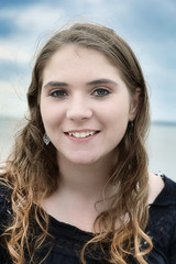 Young Model Sitting On Rocks