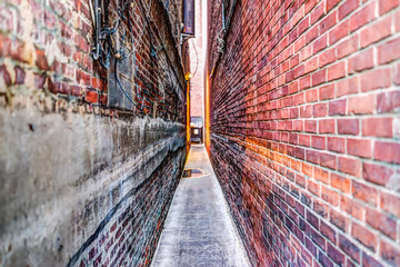 Narrow Brick alley in Georgetown, Washington DC with vintage grunge look and illuminated lights