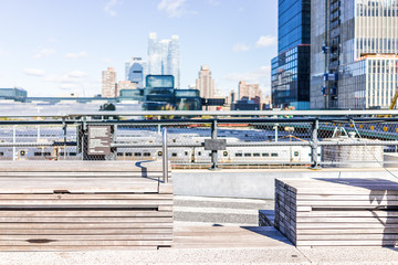 Highline, high line, urban wooden minimalistic minimal benches in New York City NYC with nobody in Chelsea West Side by Hudson Yards - obrazy, fototapety, plakaty