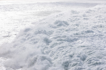 Foamy stong waves crashing in the ocean