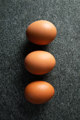 brown eggs on dark background