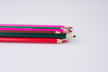 colored pencils on white background