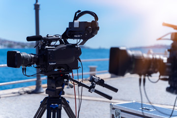 Professional digital video cameras. Accessories for 4k video cameras. Tv camera in a concert area.