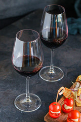 glass of wine and a snack canapes cheese plate serving size natural product portion top view place for text copy space