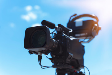 Professional digital video camera. Accessories for 4k video cameras. Tv camera in a concert area.