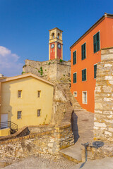 Bright orange and yellow houses in the old European city. Mediterranean architecture and color.