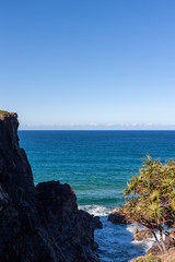 Scenic view of seascape with large rocks on coastline