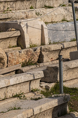 Picturesque view of Greek ruins of Theatre of Dionysos Eleuthereus - stone Roman Theater at the Acropolis hill. Theater dedicated to Dionysus, the god of plays and wine. Athens, Greece.