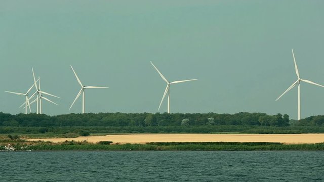 Arrival at the port of Nakskov, behind the typical Danish houses the wind turbines
