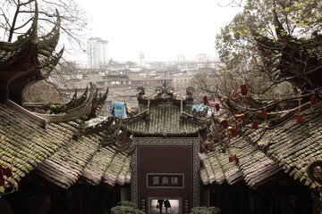 View of Typical Ancient building exterior in Dujiangyan city, Sichuan, China. Translation on wall...