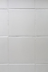 Vertical background with crookedly laid tiles
