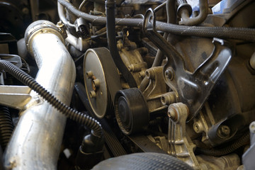Drive belt roller close-up. Modern car engine repair. Car service and spare parts. 