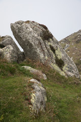 The rocky coastline of the island of Lundy emerging from the fog, The Bristol Channel, Devon, UK