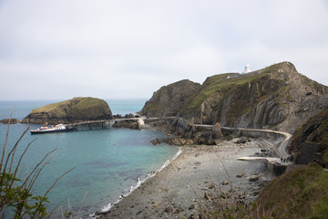 Fototapeta premium Views of the southern end of Lundy Island with a misty sky, The Bristol Channel, Devon, UK