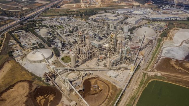 Aerial view on a huge heavy industrial factory complex at Nesher, Israel, drone 4k