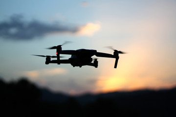 Close up picture of drone in the sky at sunset
