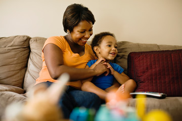 African mother playing with young son