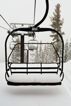 Empty ski lift on snowy mountainside