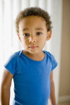 Serious mixed race young boy