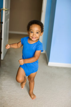 Young mixed race boy running