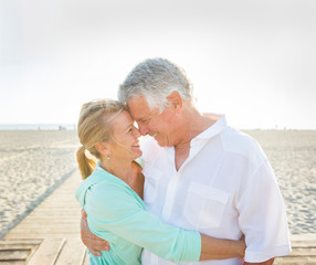 Caucasian couple hugging on beach