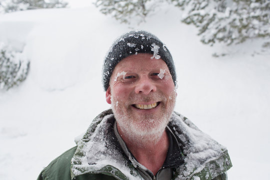 Caucasian man covered with ice and snow
