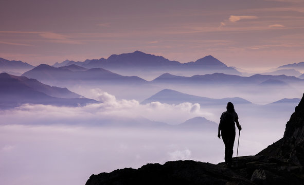 Italy, Piedmont, Alps, Monte Rosa, Silhouette of female climber on mountain ridge