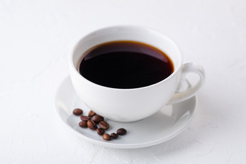 white coffee mug on a white background. Coffee beans. photo