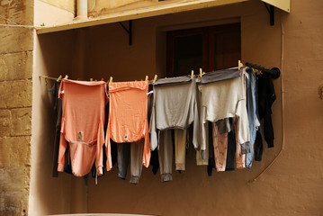 freshly washed linen neatly hung on the clothesline in the old city district
