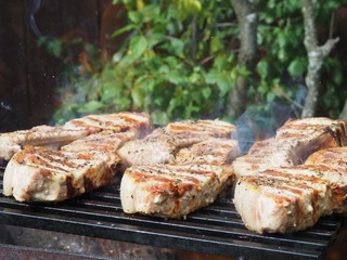 roasting steaks on the fire.flambé.flamber.meat on the bone on the grill.