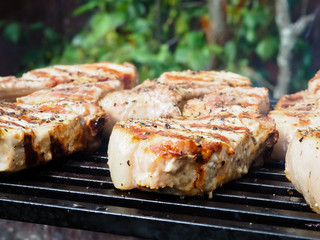 roasting steaks on the fire.flambé.flamber.meat on the bone on the grill.