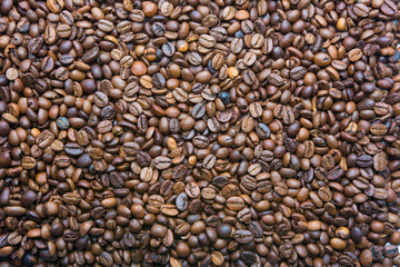 Background of brown color from roasted coffee beans top view