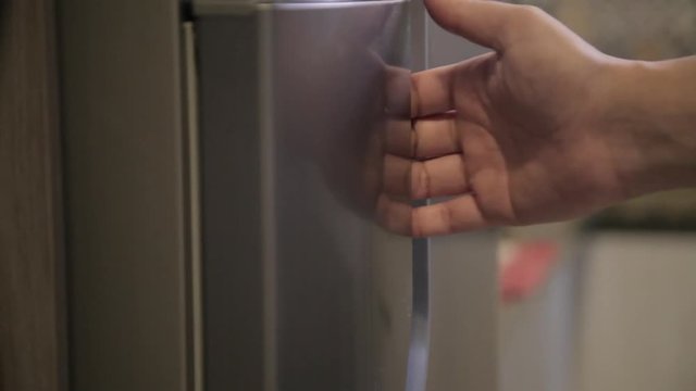 Opening the refrigerator door