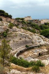 Roman Amphitheatre of Cagliari on a cloudy summer day