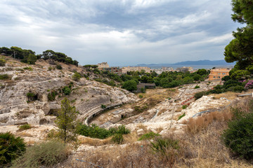 Fototapeta na wymiar Roman Amphitheatre of Cagliari on a cloudy summer day