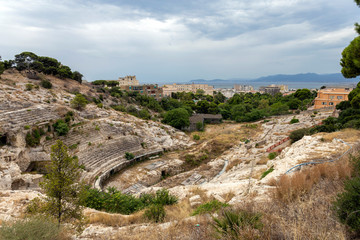 Roman Amphitheatre of Cagliari on a cloudy summer day