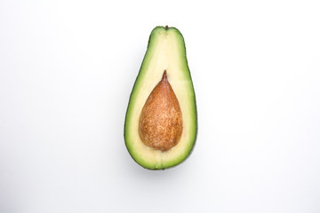 Half Avocado on a white background top view.
