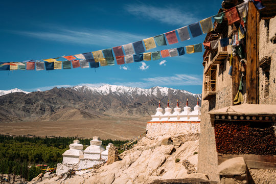 India, Ladakh, Colorful prayer flags hanging outside Buddhist temple